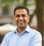 middle aged indian business man in casual wear outdoor looking straight